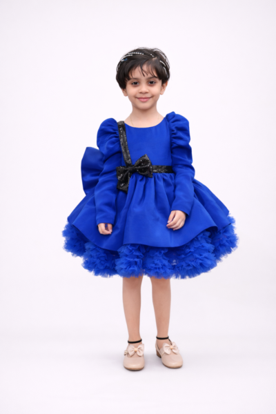 Royal blue girls party dress with puff sleeves, black sequin bow and layered flared skirt